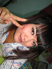 Teen Ladyboy Ping fucks herself with a big green cucumber - Asian ladyboys porn at Thai LB Sex