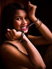 Submissive Ladyboy teenager in handcuffs and blue stockings - Asian ladyboys porn at Thai LB Sex